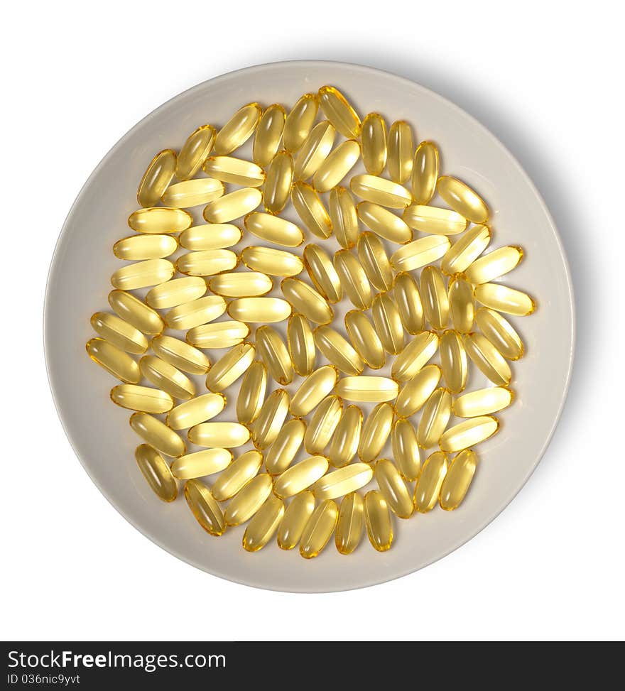 Gold capsules on plate