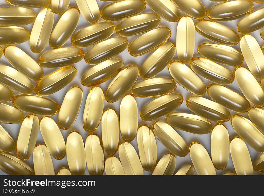 Gold capsules as background