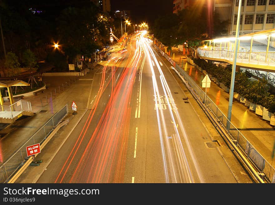 Busy traffic in downtown of Hong Kong, show the bright side of Hong Kong - Pearl of the East. It is taken in Tuen Mun of Hong Kong.