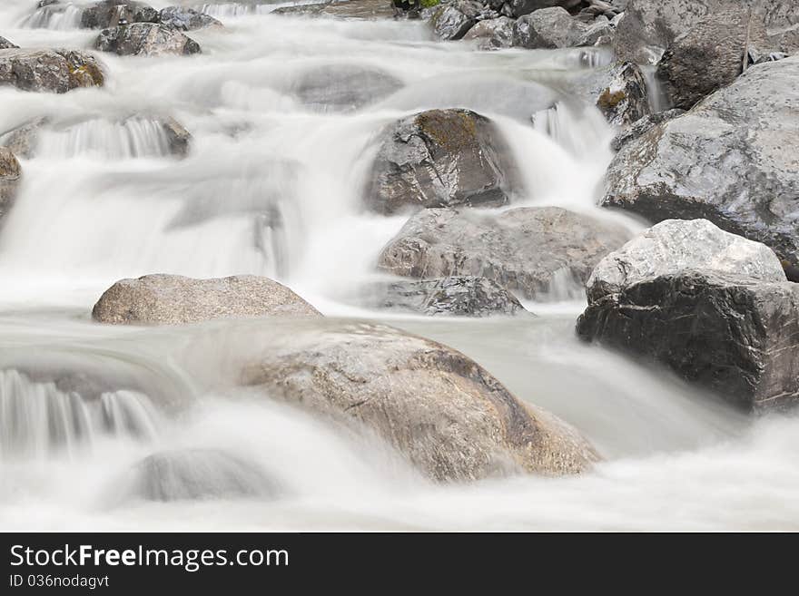 View on waterfall cascade in green forest