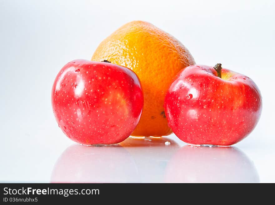 Food Related: Apples and Orange Isolated on a White Background