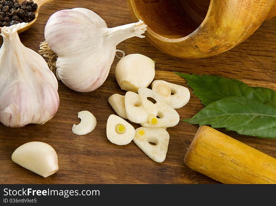 Set of garlic and spice on wooden texture