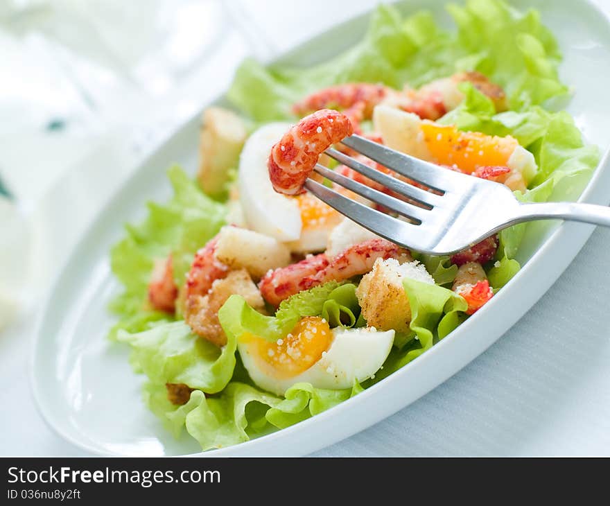 Fresh salad with shrimp and egg for appetizer