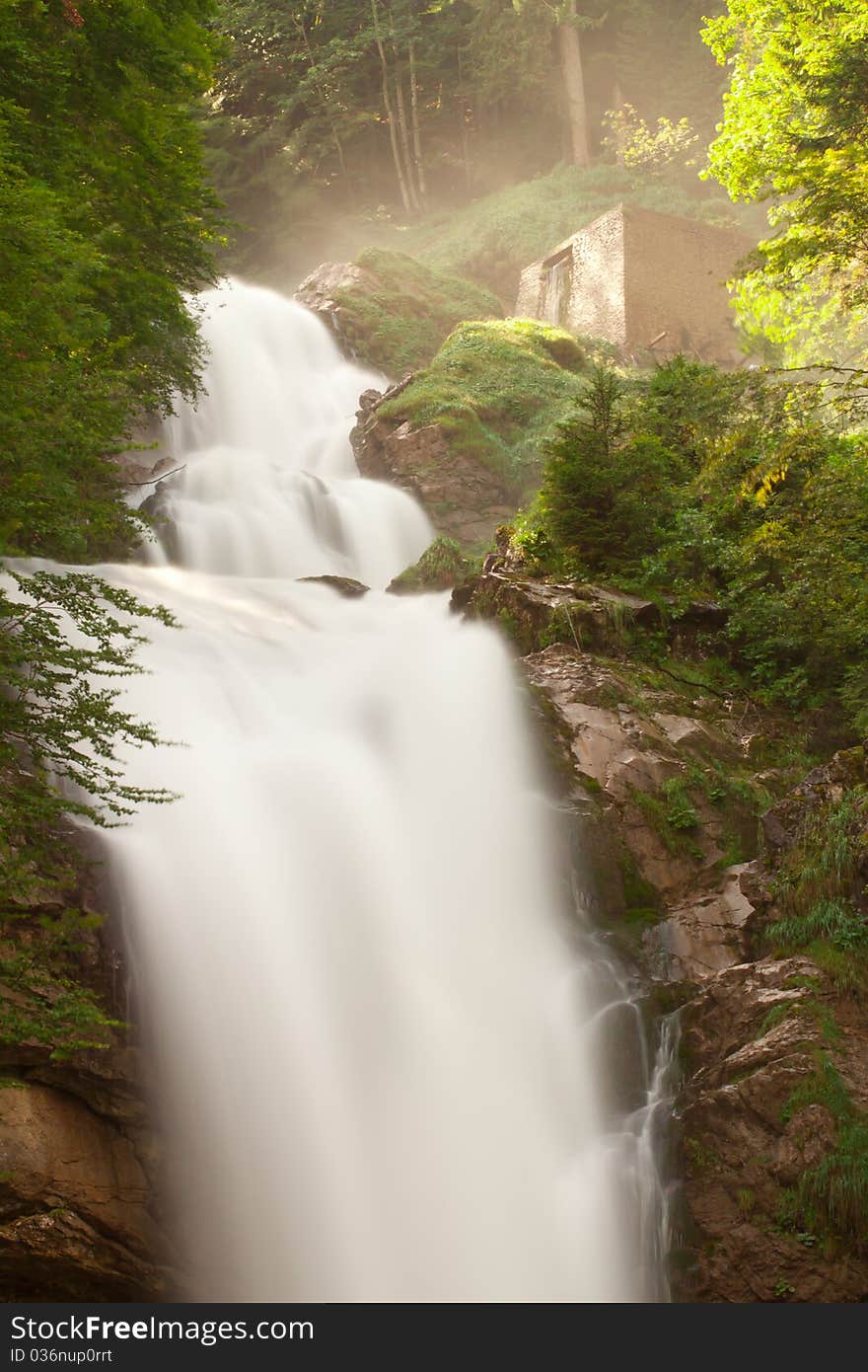 View on waterfall Giessbachfall and green forest, Switzerland