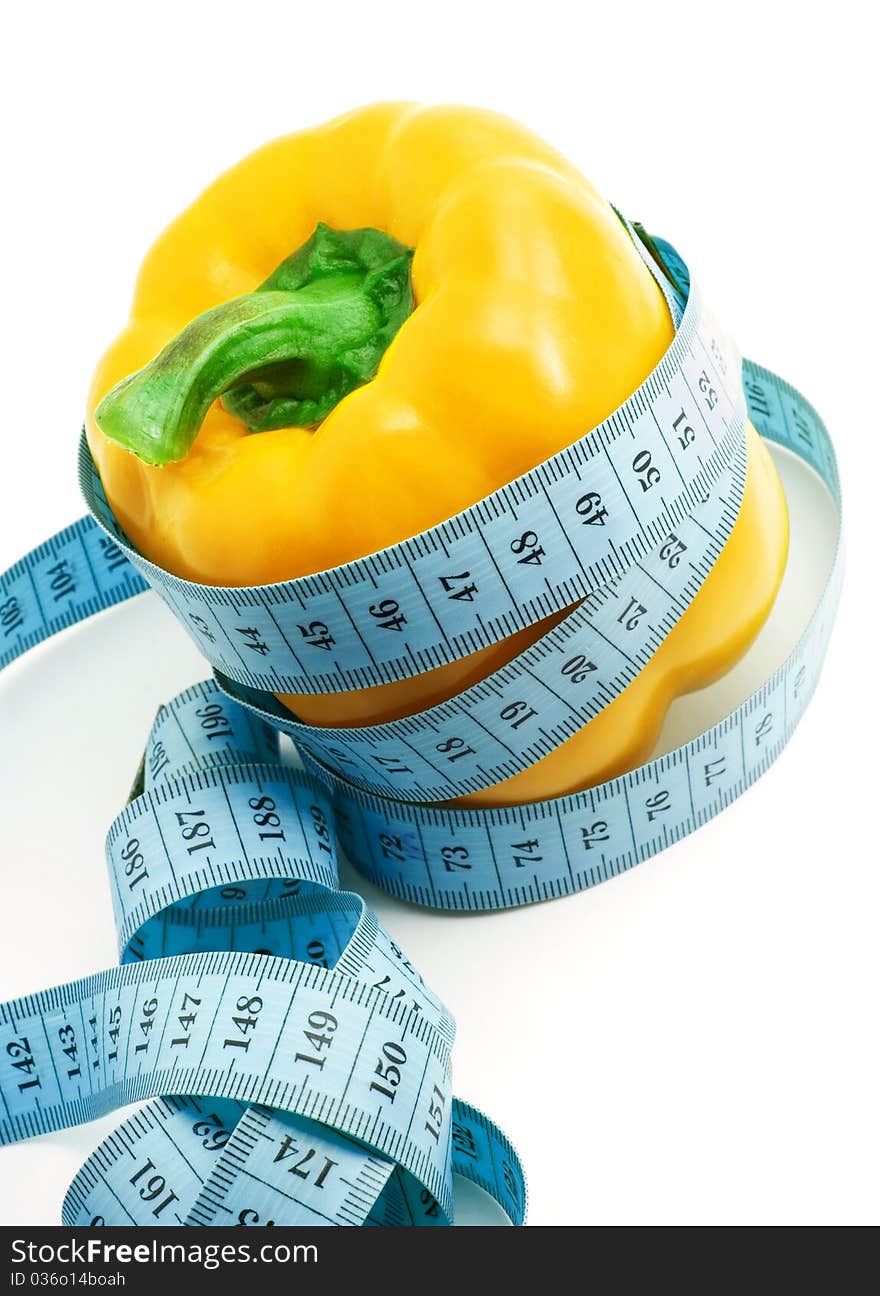 Bulgarian pepper and centimeter, white background, isolated