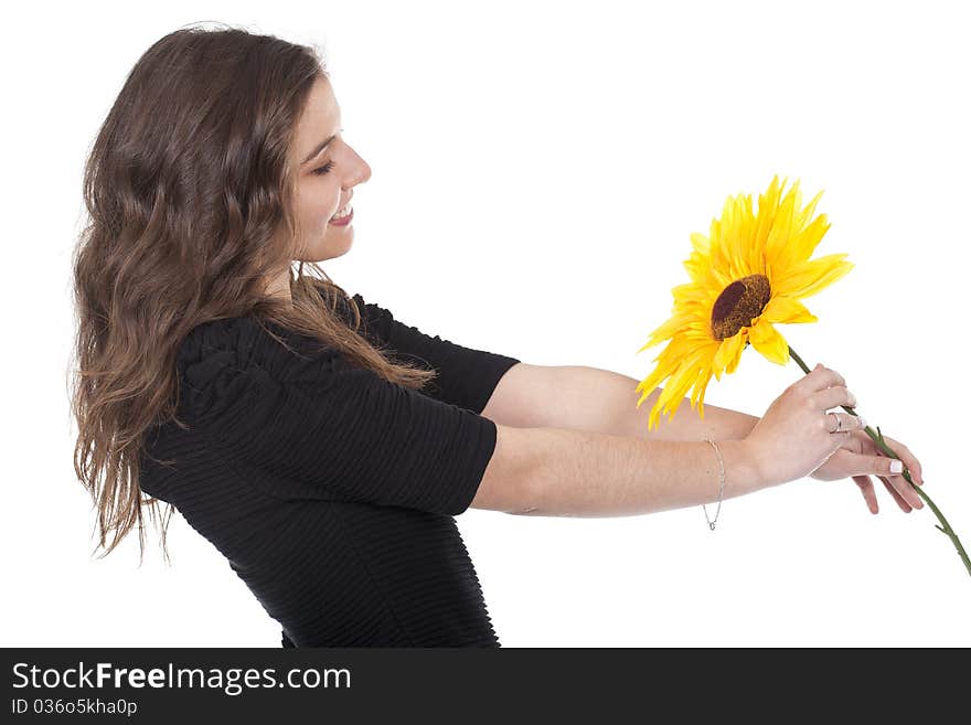 A beautiful and smiling woman holding a sunflower