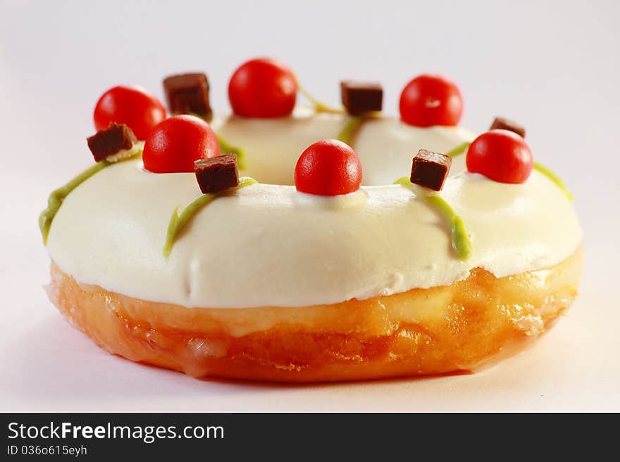 Delicious white doughnut with amzing topping, close up