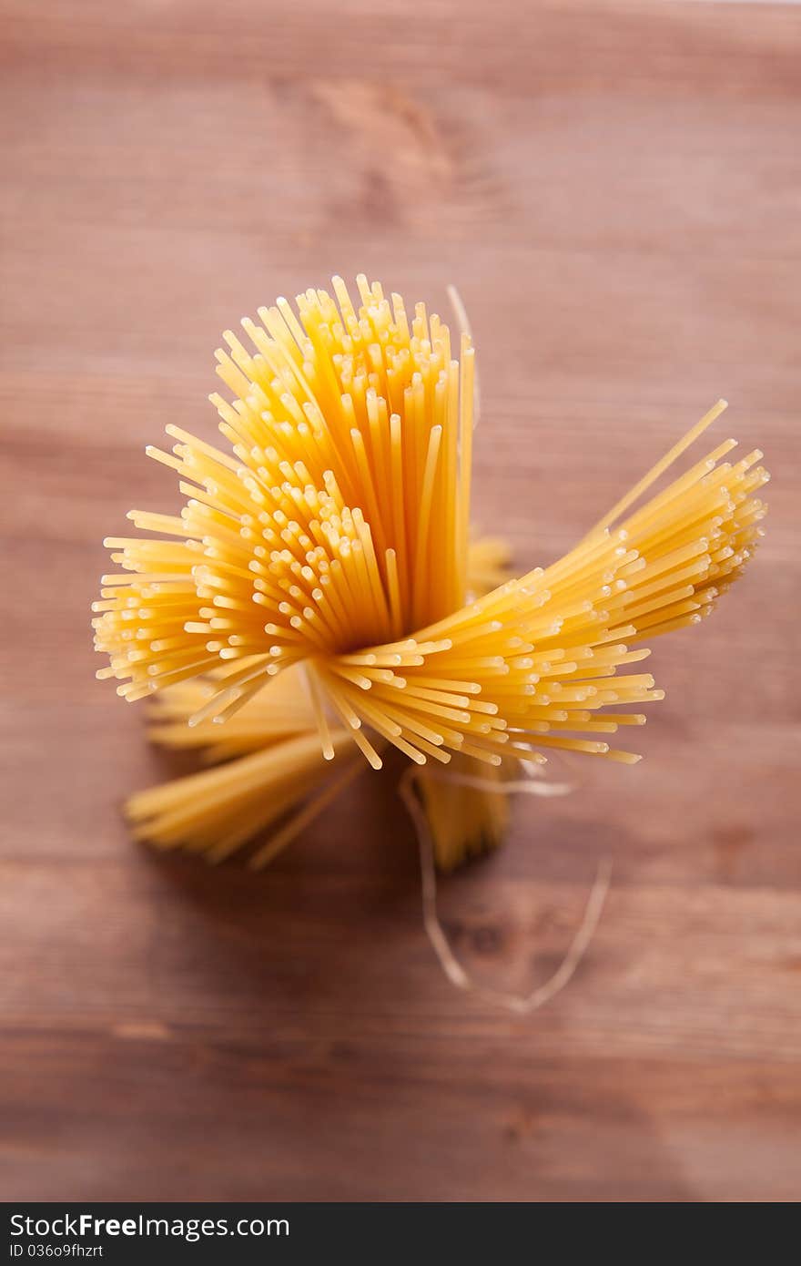 Bunch of spaghetti on a wooden table