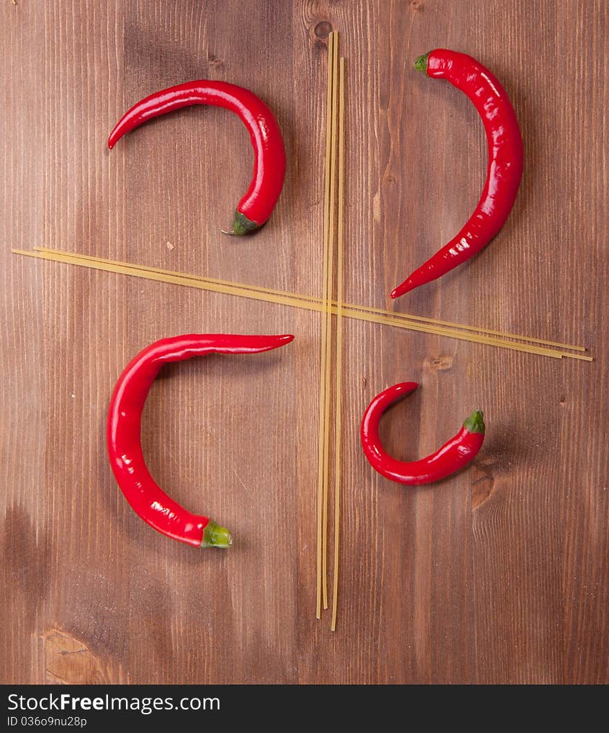 Four section from spaghetti with red hot chilli peppers