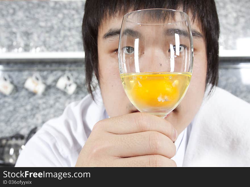 Chef considering a glass of raw egg