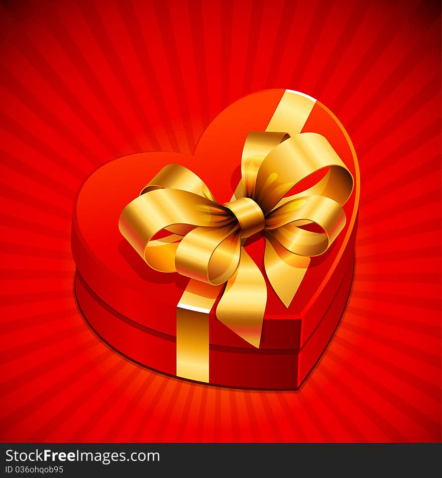 Red heart shape gift with golden bow