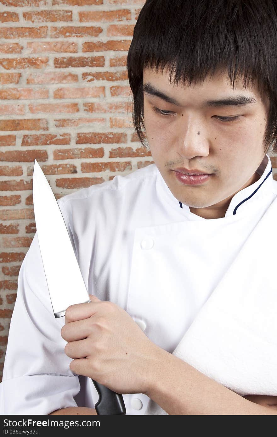 Chef holda knife in action. Chef holda knife in action.