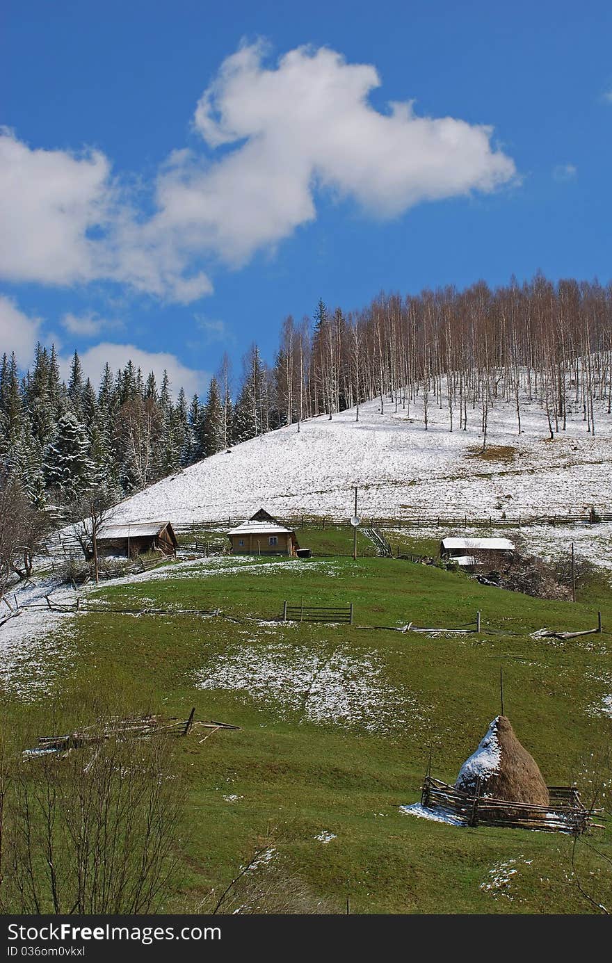 Spring on a hillside in a landscape under clouds. Spring on a hillside in a landscape under clouds