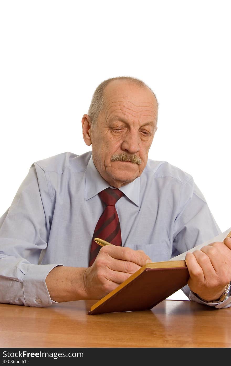 The businessman does records in a notebook on white