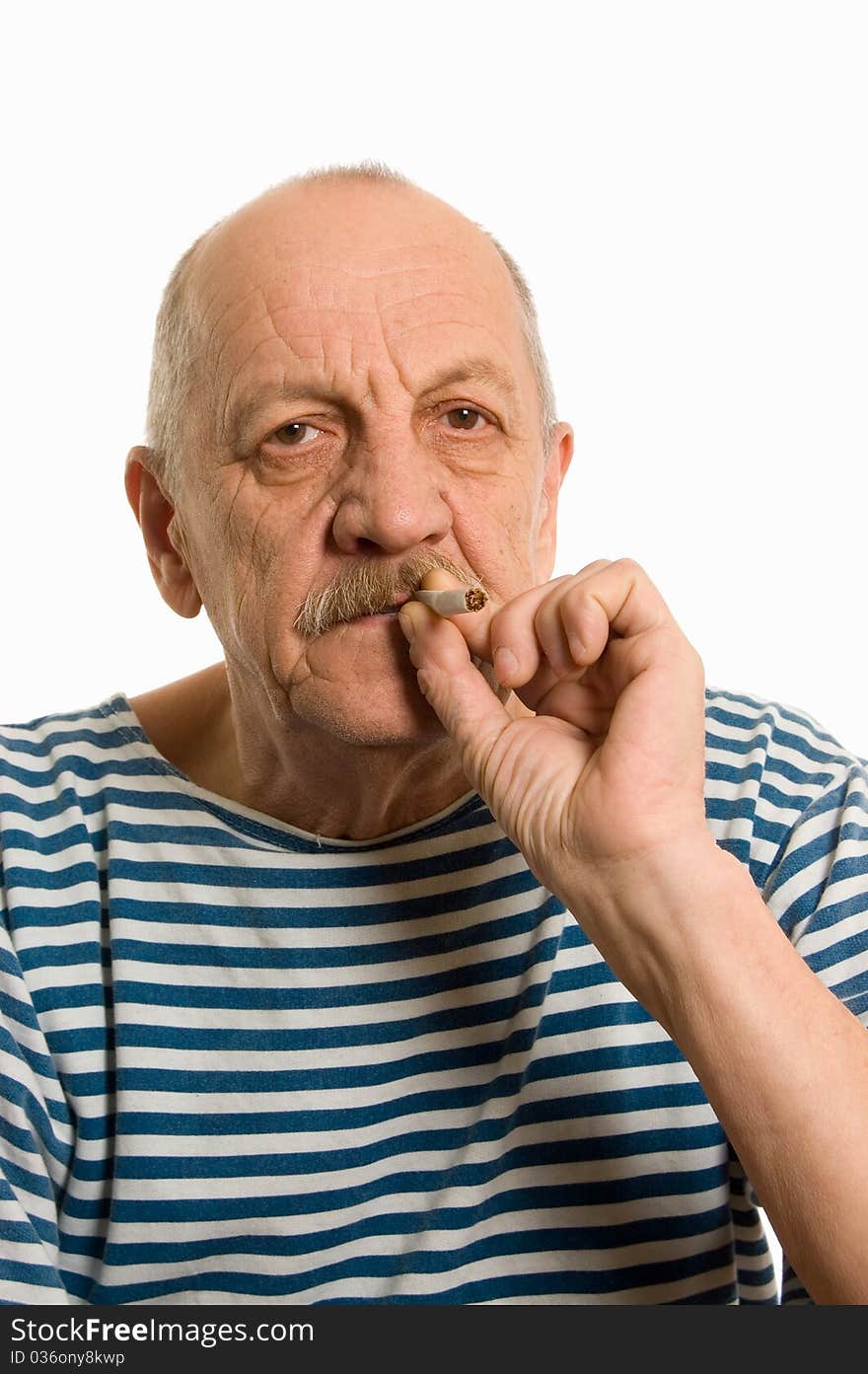 Elderly man in a stripped vest smokes on white