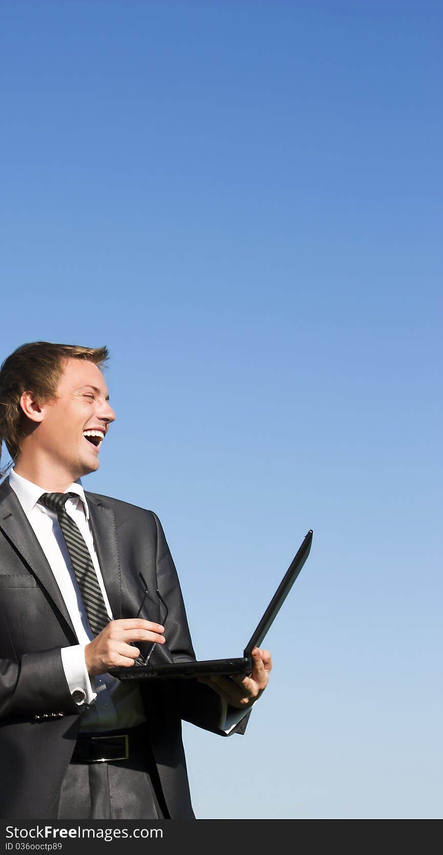 Businessman working with a laptop outdoor. Businessman working with a laptop outdoor