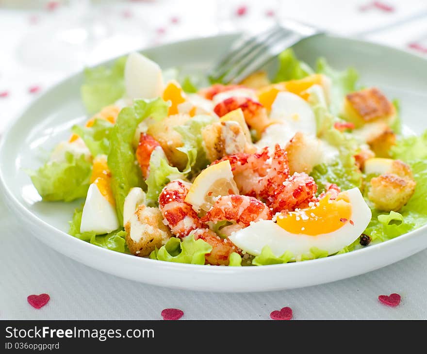 Fresh salad with shrimp and egg for appetizer