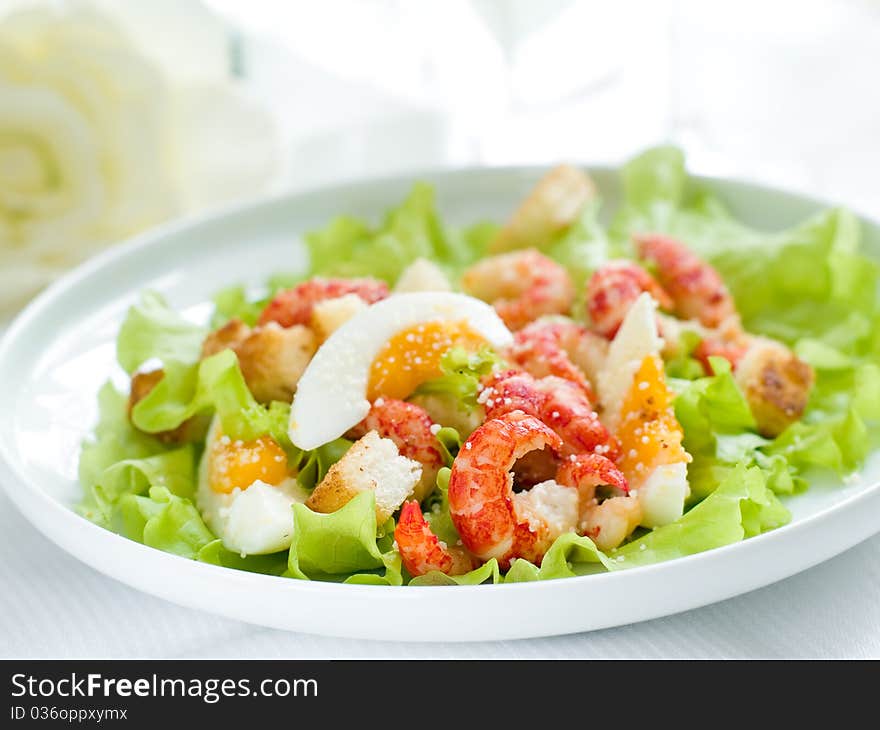 Fresh salad with shrimp and egg for appetizer