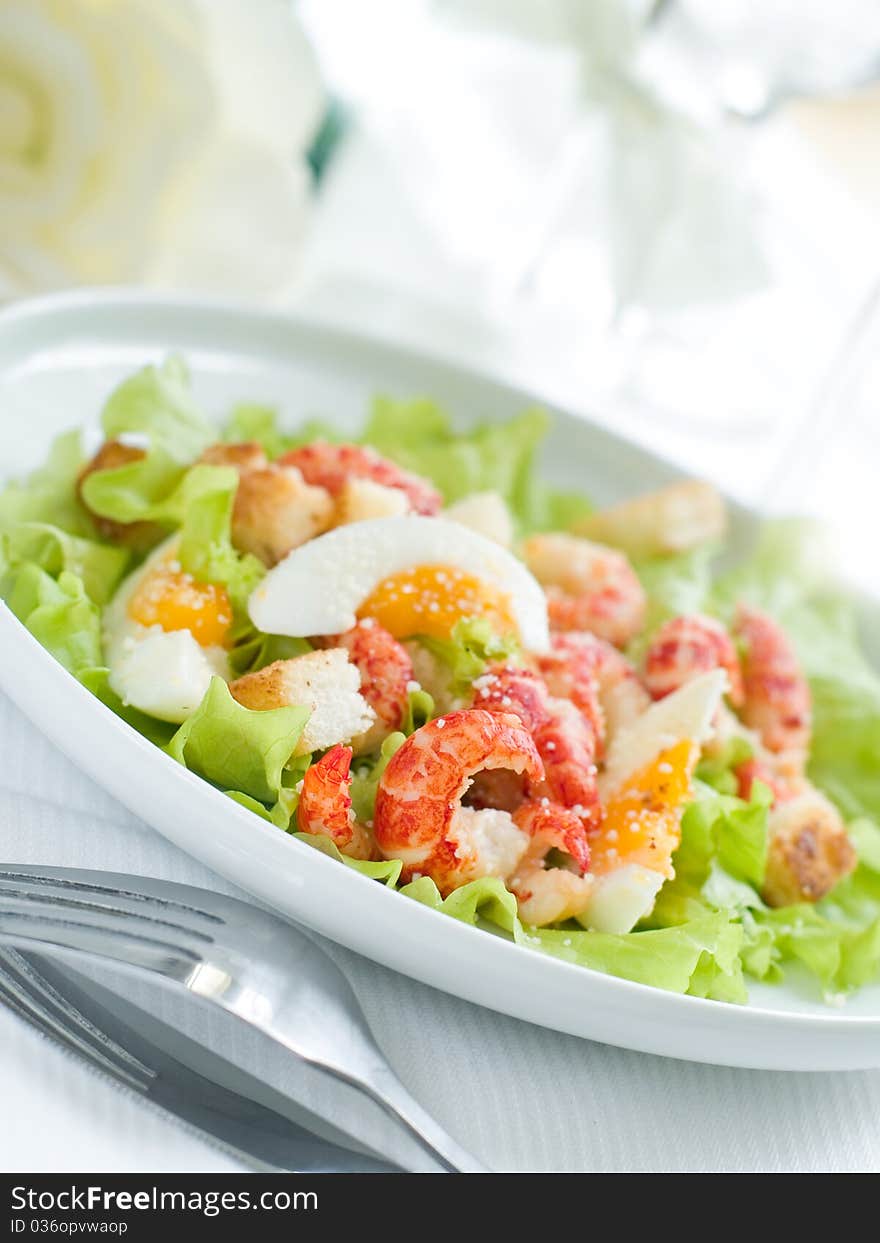 Fresh salad with egg and shrimp for appetizer