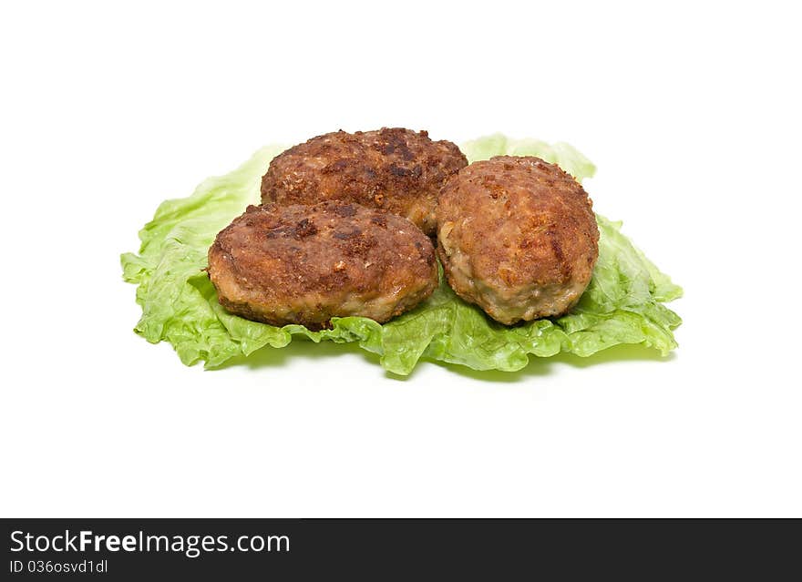 Frikadeller with a salad on a white background