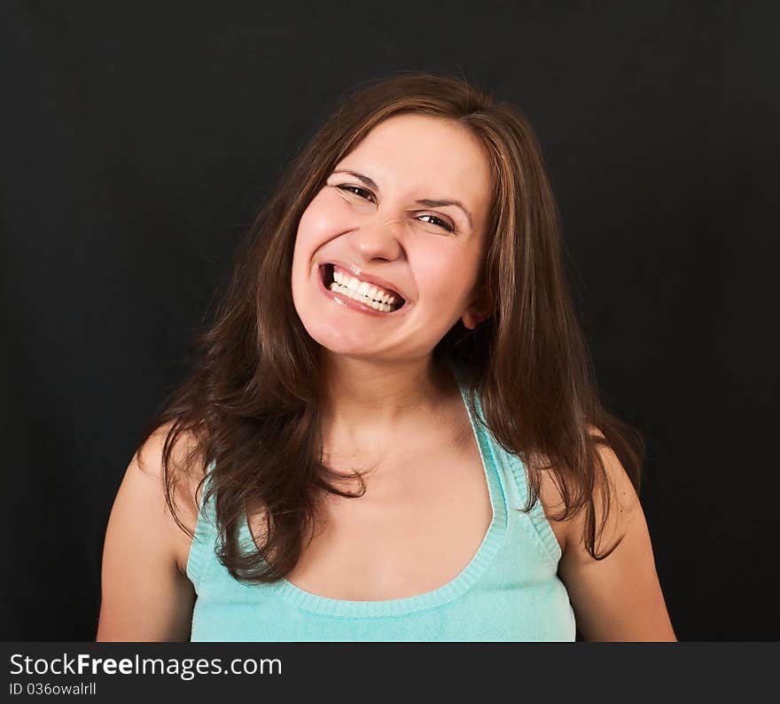 Portrait of a beautiful young girl on a black background. Portrait of a beautiful young girl on a black background