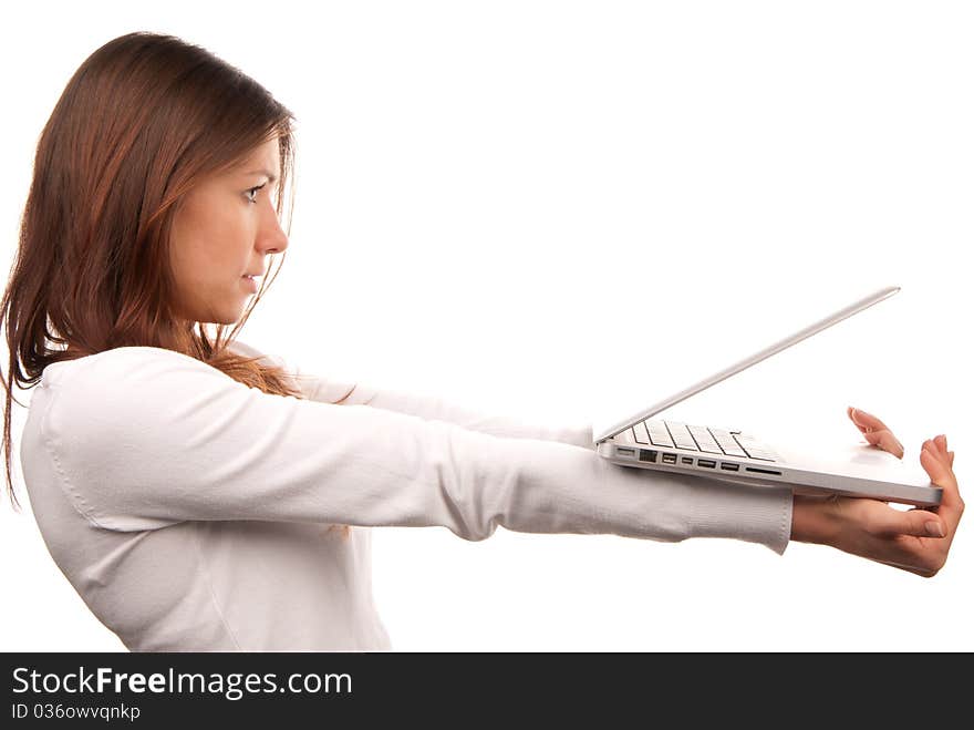 Young woman giving laptop computer, holding laptop in hands isolated on a white background