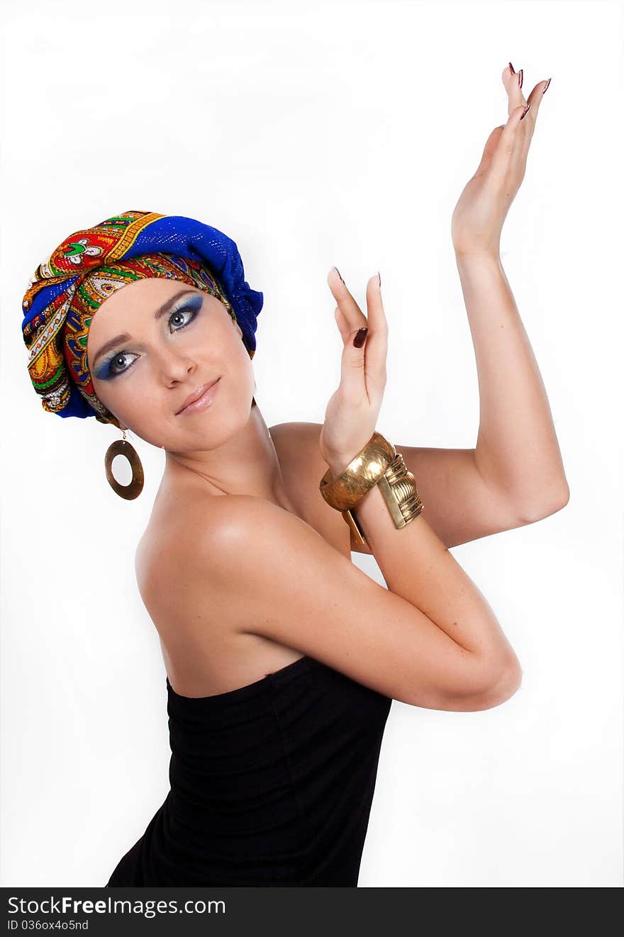 Portrait of young attractive woman in turban with bright make-up over white. Portrait of young attractive woman in turban with bright make-up over white