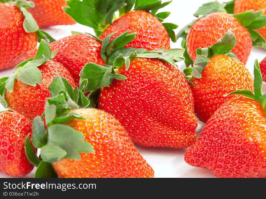 Fresh natural organic strawberries isolated on a white background