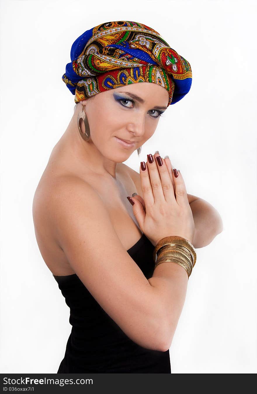 Portrait of young attractive woman in turban with bright make-up over white. Portrait of young attractive woman in turban with bright make-up over white