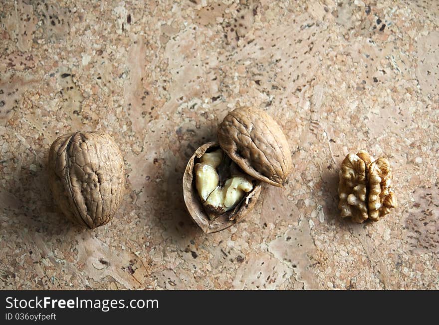 Walnuts isolated on cork background