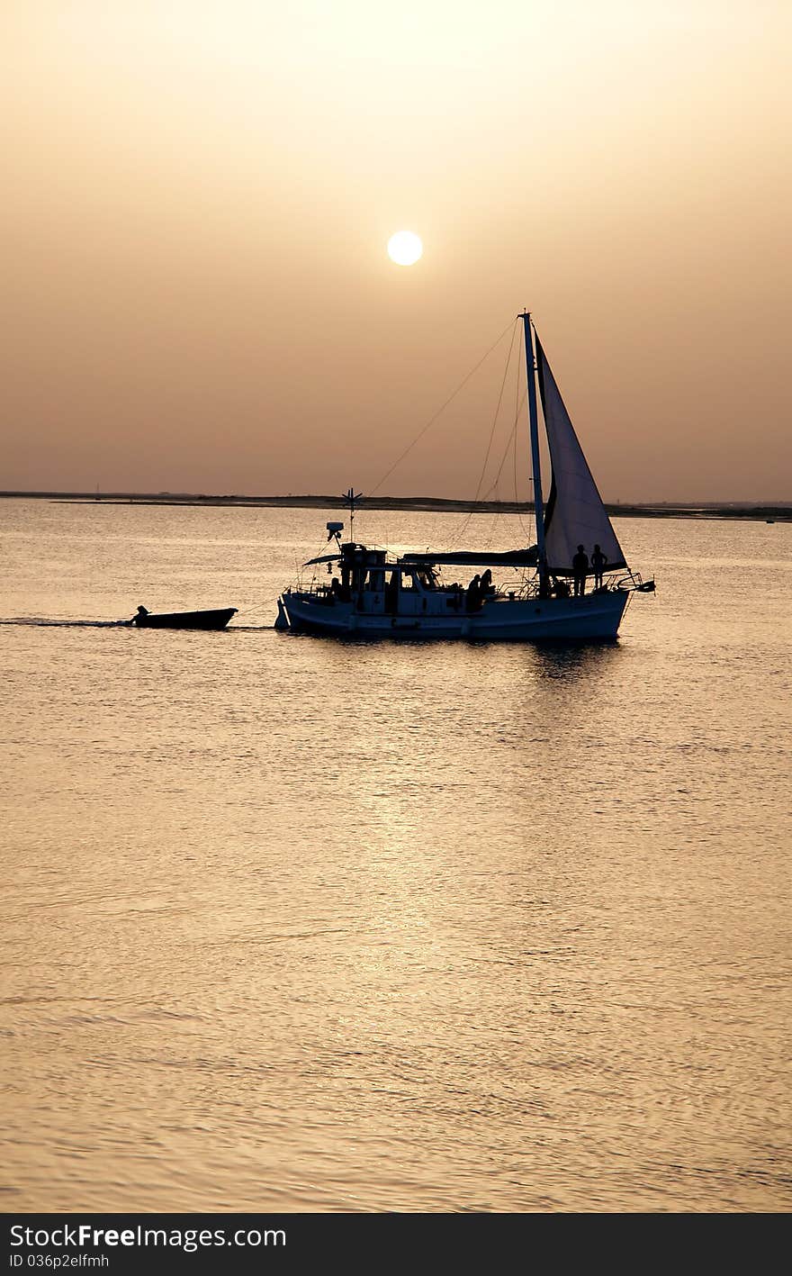 Recreation boat at sunset, in Ria Formosa, natural conservation region in Algarve, Portugal. Recreation boat at sunset, in Ria Formosa, natural conservation region in Algarve, Portugal.