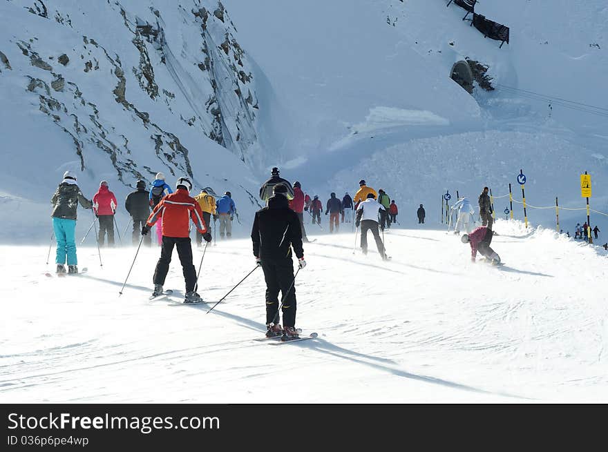 Skiers on crowded slope of Austrian glacier in Solden can't wait to start downhill. Skiers on crowded slope of Austrian glacier in Solden can't wait to start downhill.