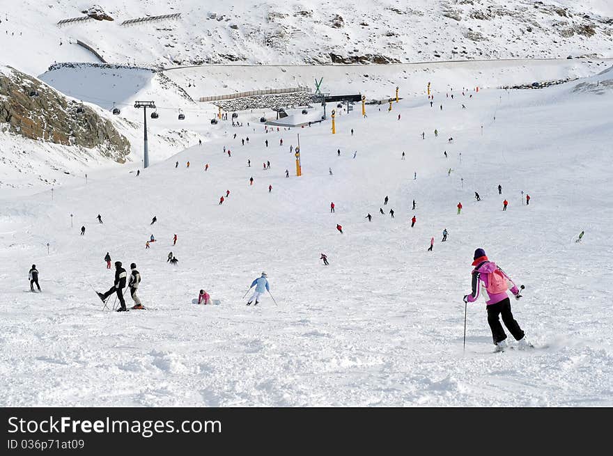 People skiing in european alps.