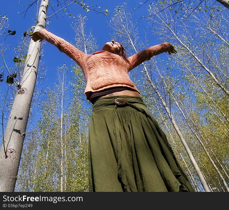 Young woman in woods feeling freedom. Young woman in woods feeling freedom