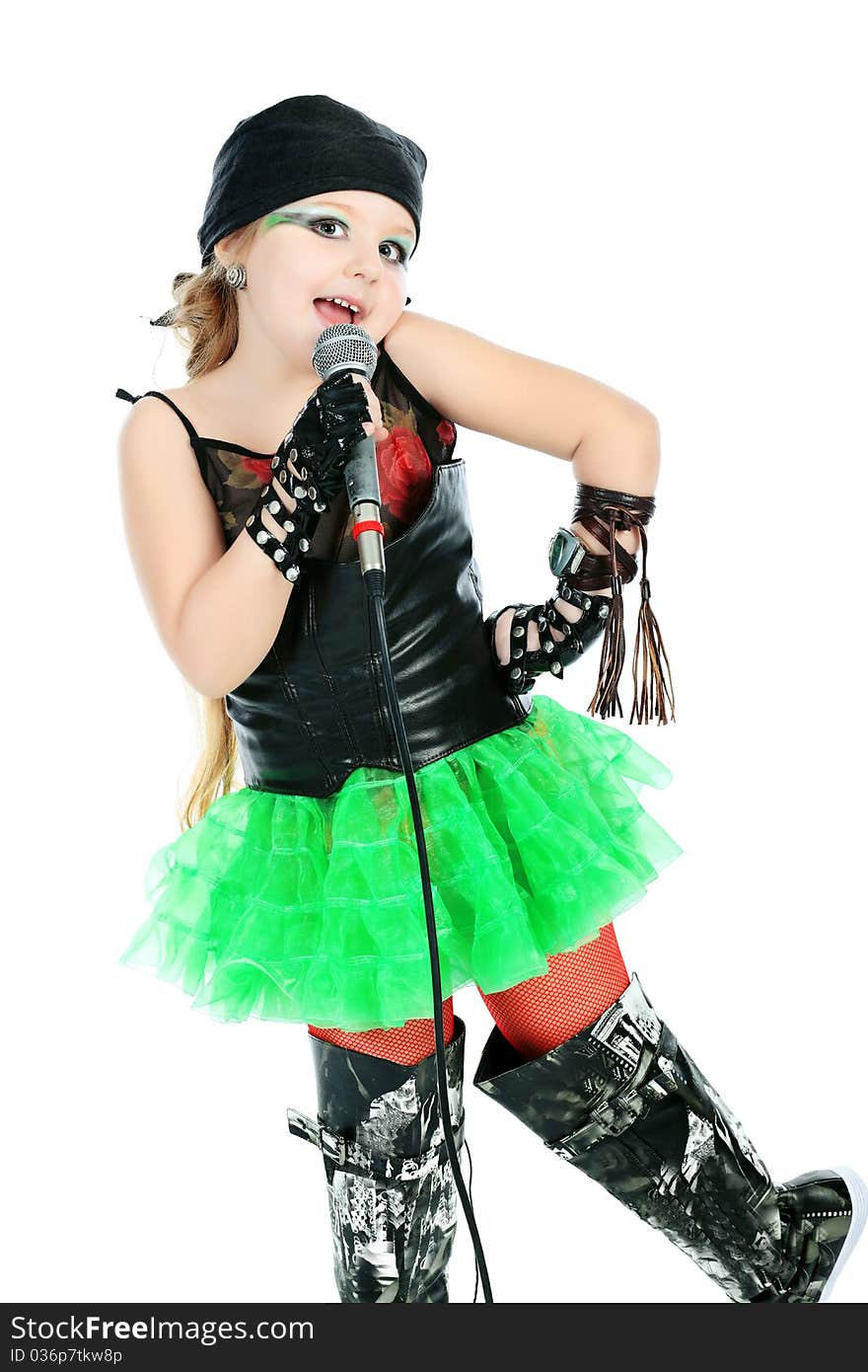 Shot of a little girl singing rock music with a microphone. Isolated over white background. Shot of a little girl singing rock music with a microphone. Isolated over white background.