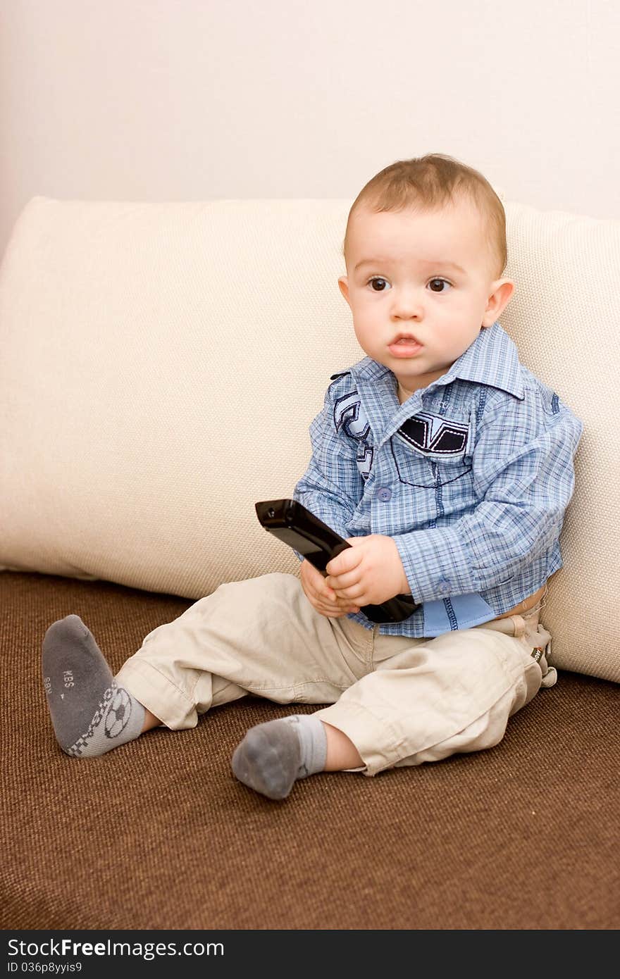 Cute caucasian boy with tv console