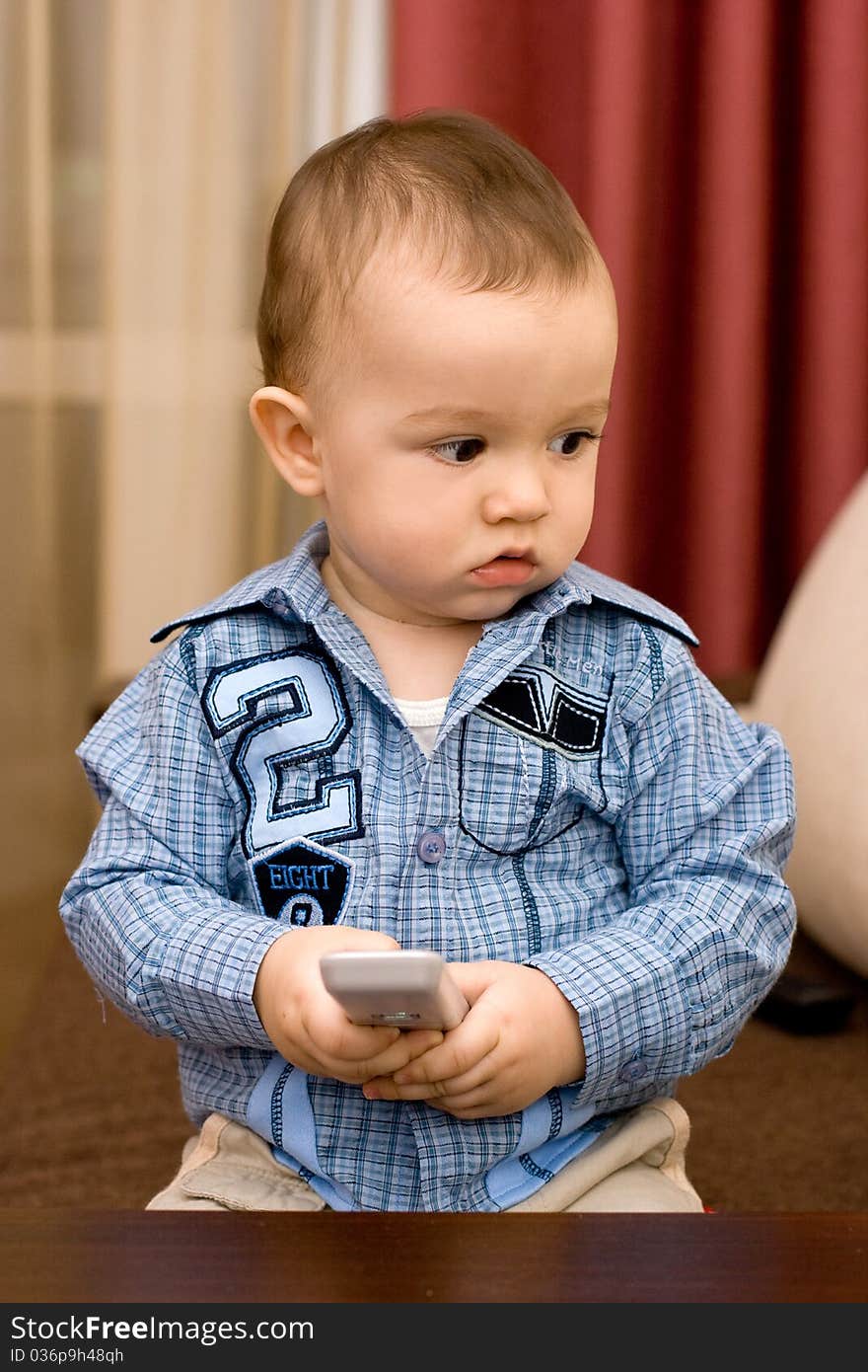 Cute caucasian boy with tv console