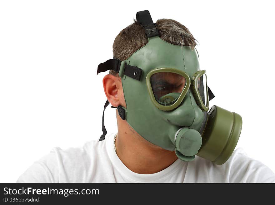 MAn in gas mask sitting and looking something with angry face. MAn in gas mask sitting and looking something with angry face