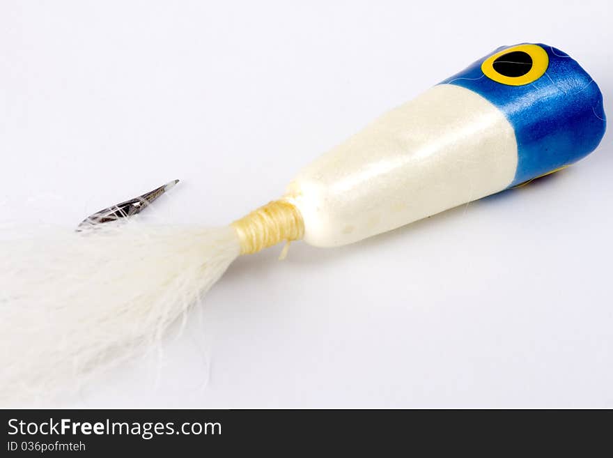 Blue Popper salt water fly isolated on a white background. Blue Popper salt water fly isolated on a white background