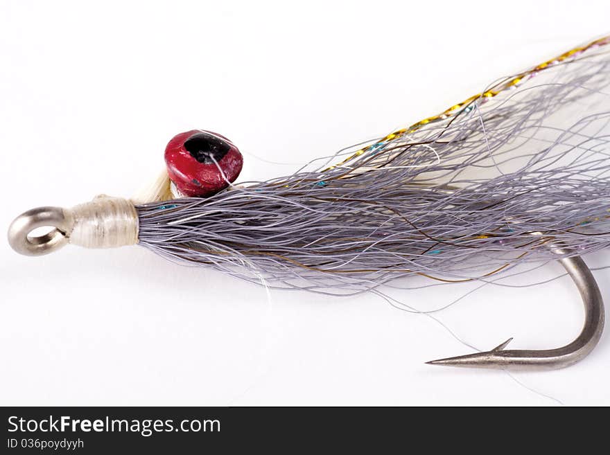 Deep Minnow style salt water fly isolated on a white background. Deep Minnow style salt water fly isolated on a white background