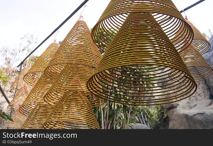 Coil incense hanging on the temple