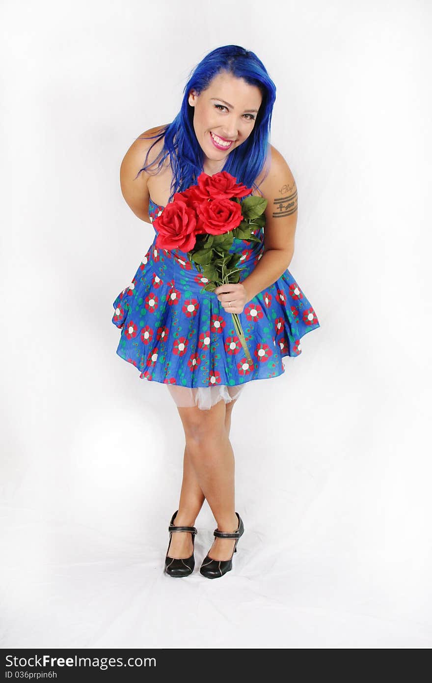 Portrait of a beautiful woman holding a bouquet of roses