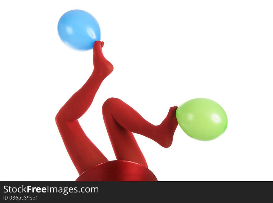 Female feet in red stockings with balloons isolated in white