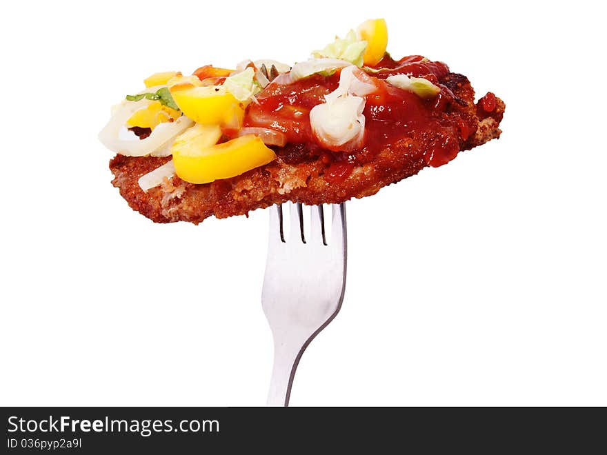 Fried steak on a fork on a white background