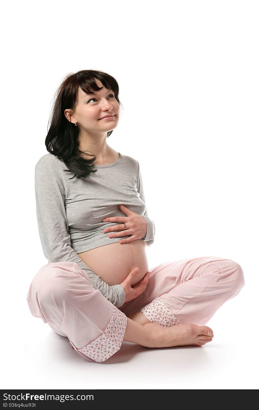 Pregnant young woman in studio. Pregnant young woman in studio