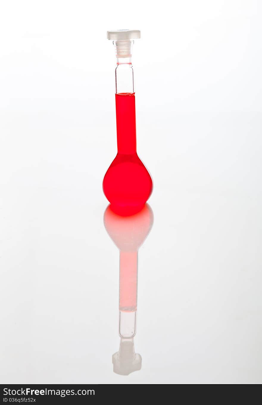 Labolatory glassware with colorful fluids isolated