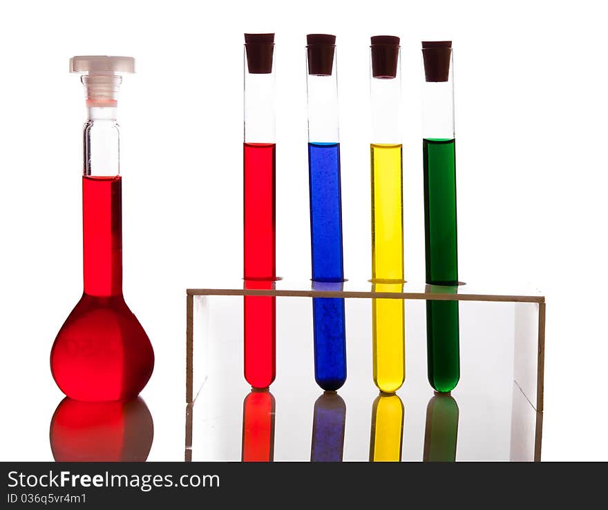 Labolatory glassware with colorful fluids isolated