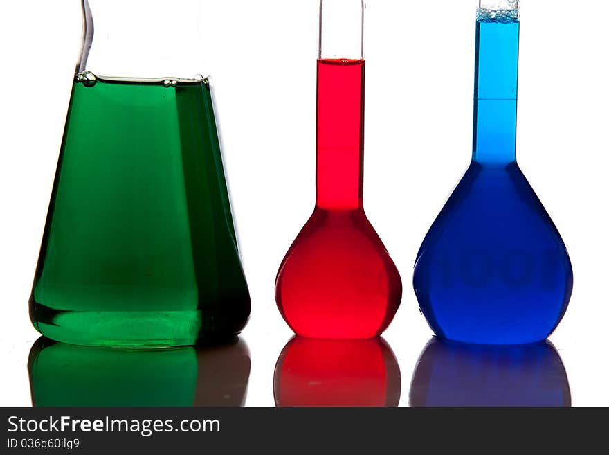 Labolatory glassware with colorful fluids isolated