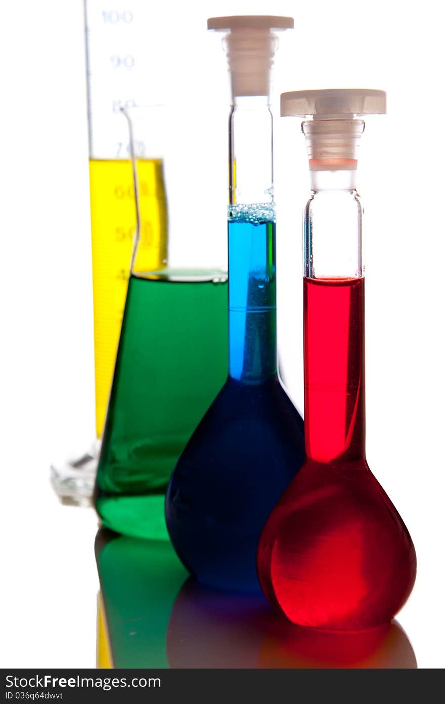 Labolatory glassware with colorful fluids isolated