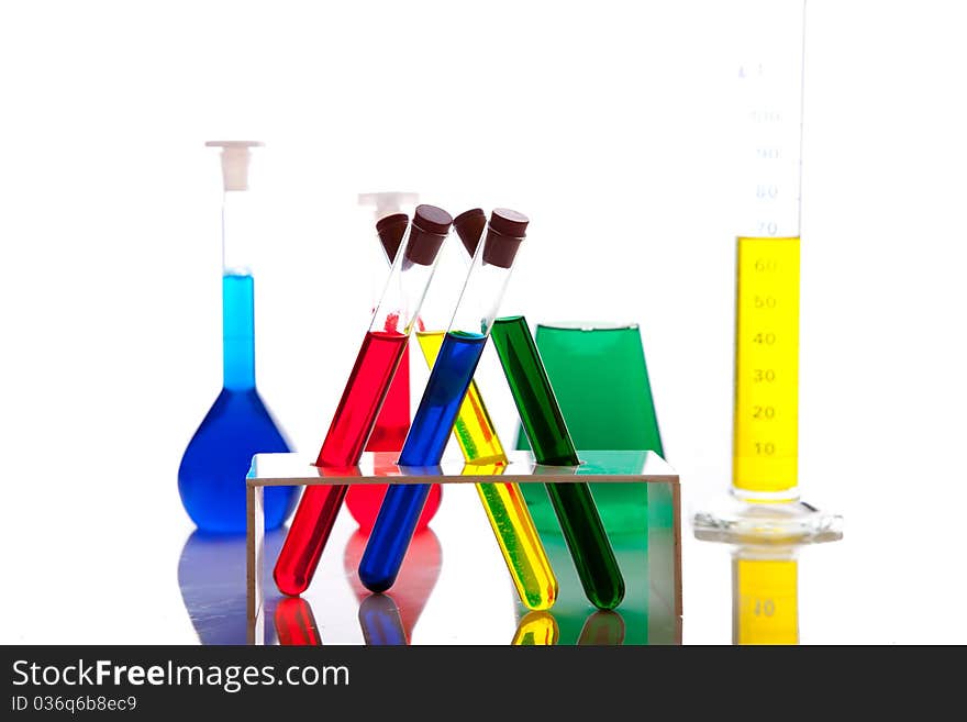 Labolatory glassware with colorful fluids isolated